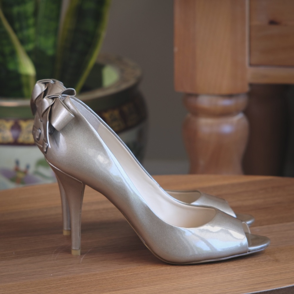 Franco Sarto peek a boo pumps w bow on the back